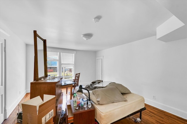 sitting room with wood-type flooring