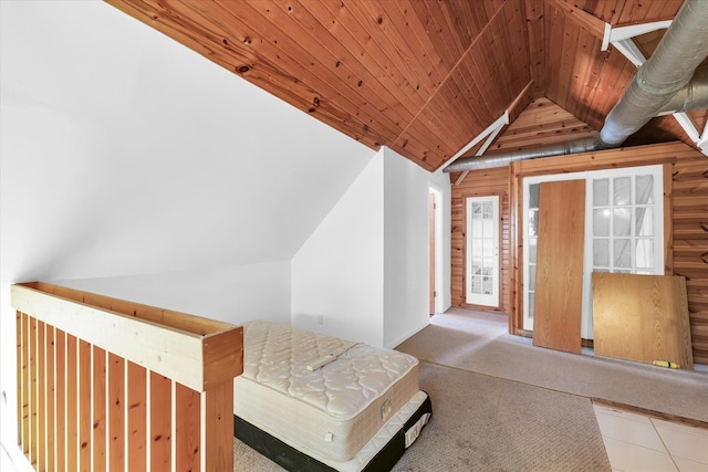 bonus room with wood ceiling, wood walls, carpet floors, and vaulted ceiling