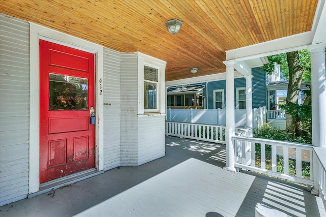 property entrance featuring covered porch