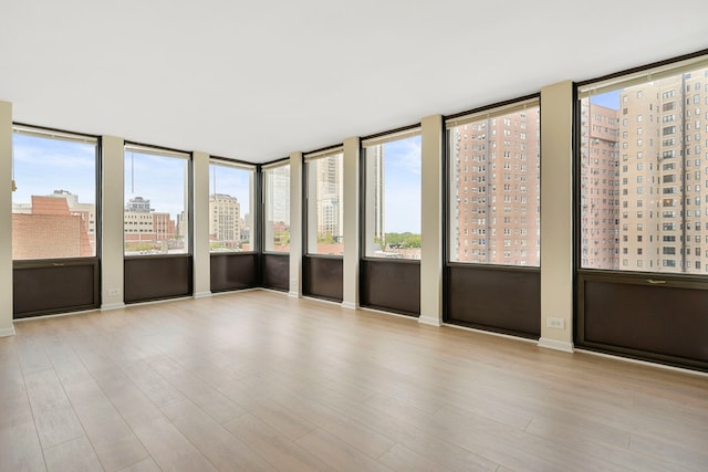 unfurnished sunroom featuring a healthy amount of sunlight