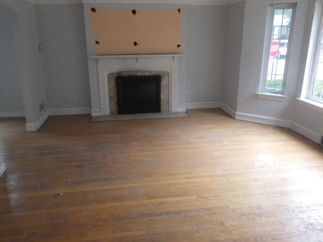 unfurnished living room with hardwood / wood-style floors