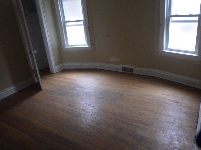 empty room featuring dark hardwood / wood-style floors