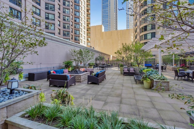 400 E Ohio St Unit 4502, Chicago, IL 60611 - view of home's community featuring an outdoor living space with a fire pit and a patio area