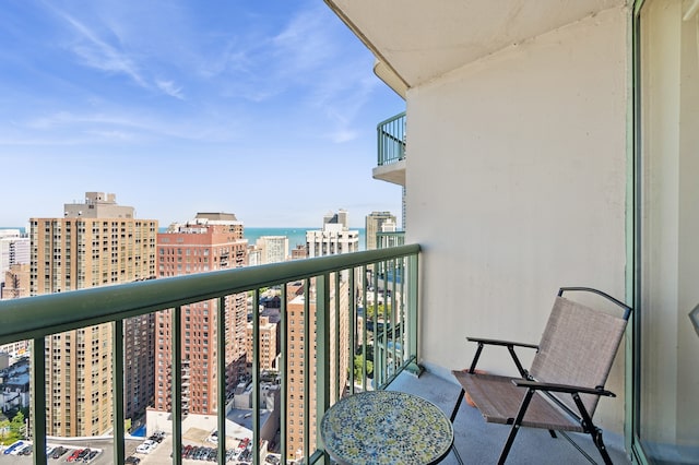 balcony featuring a water view