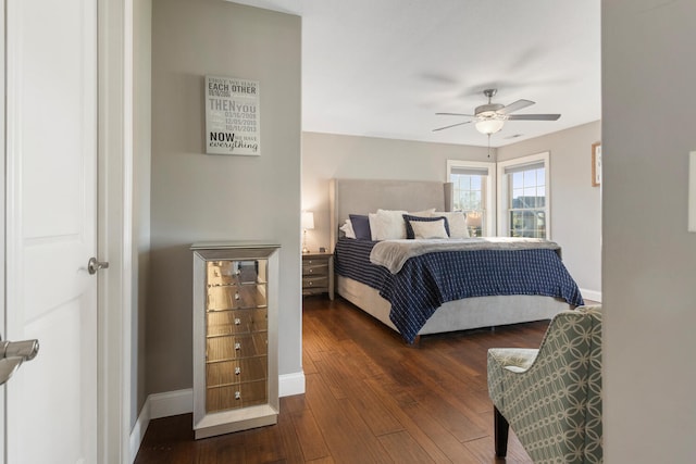 bedroom with ceiling fan and dark hardwood / wood-style floors