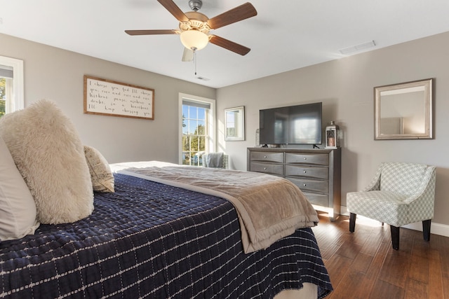 bedroom featuring ceiling fan and dark hardwood / wood-style floors