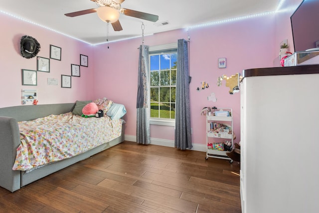 bedroom with ceiling fan and hardwood / wood-style floors