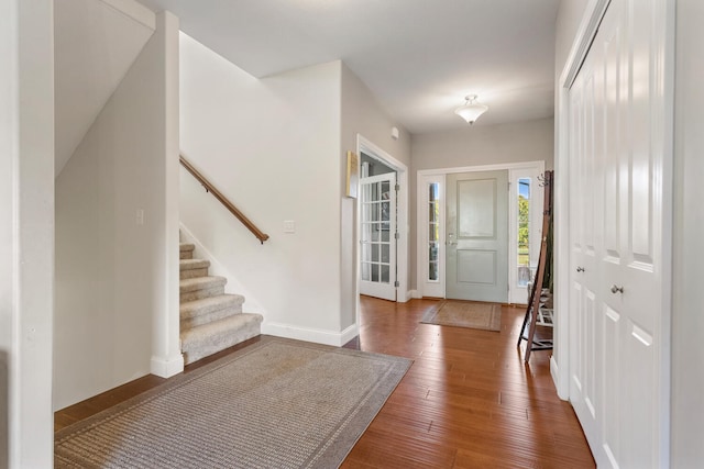 entrance foyer with dark hardwood / wood-style floors