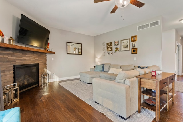 living room featuring dark hardwood / wood-style floors and ceiling fan