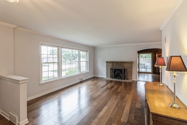 unfurnished living room with a fireplace, dark hardwood / wood-style floors, and crown molding