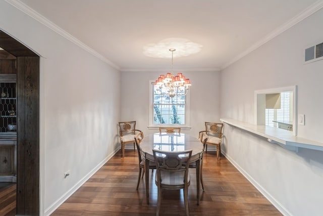 dining space with an inviting chandelier, ornamental molding, and dark hardwood / wood-style flooring