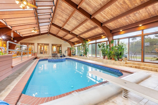 view of pool with a diving board and ceiling fan