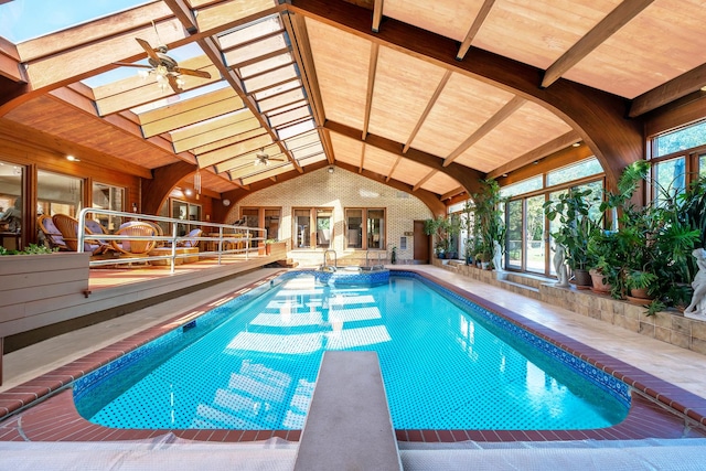 view of pool featuring a diving board and ceiling fan