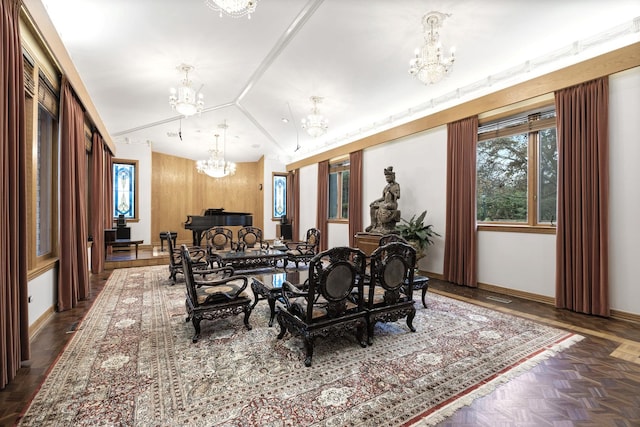 dining area featuring dark parquet flooring