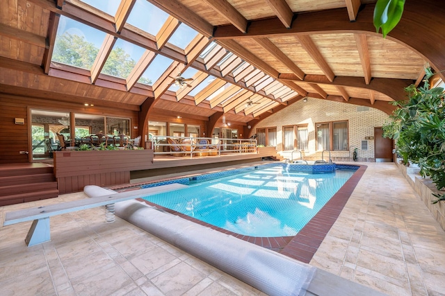 view of pool featuring a diving board, a jacuzzi, and a patio