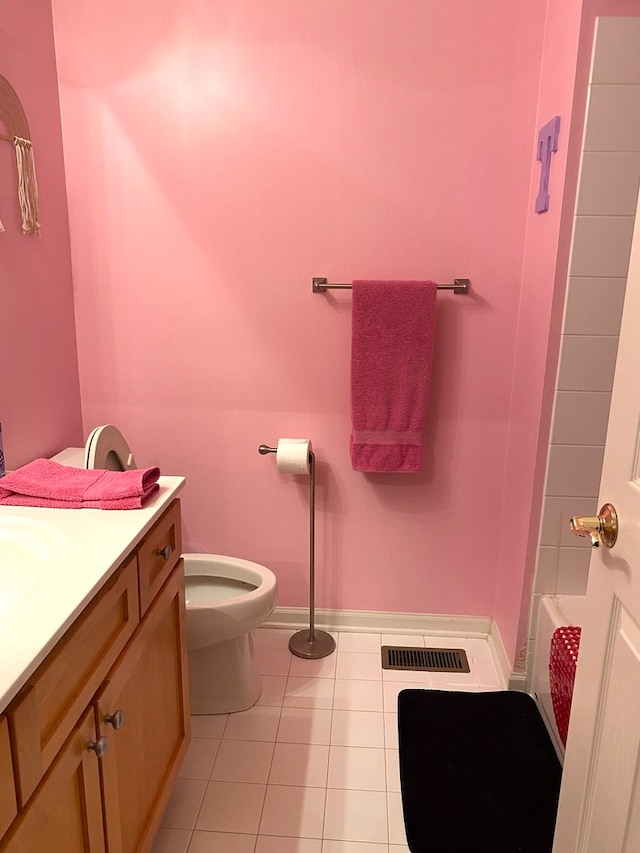 bathroom featuring tile patterned floors, vanity, and toilet