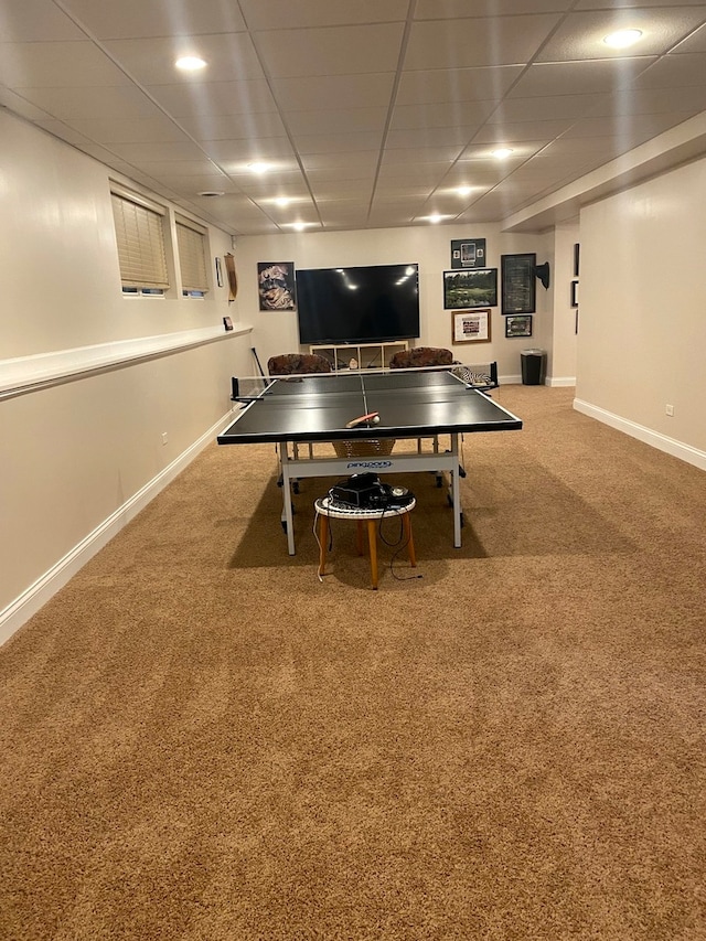 game room featuring carpet floors and a drop ceiling