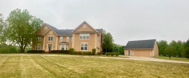 view of front of home featuring a garage and a front lawn