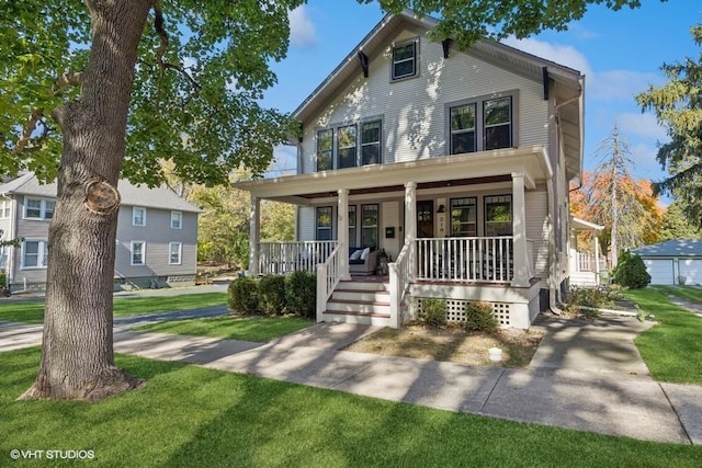 view of front facade featuring covered porch and a front yard