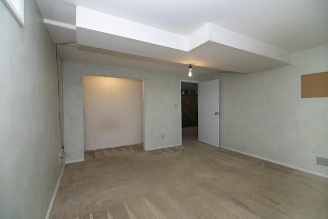 basement with light colored carpet