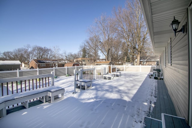 view of snow covered deck