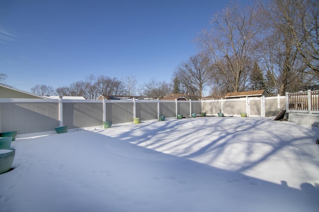 view of yard covered in snow