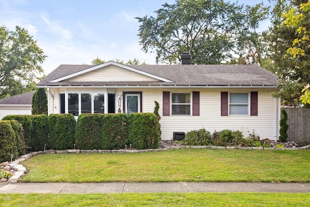 ranch-style home featuring a front lawn