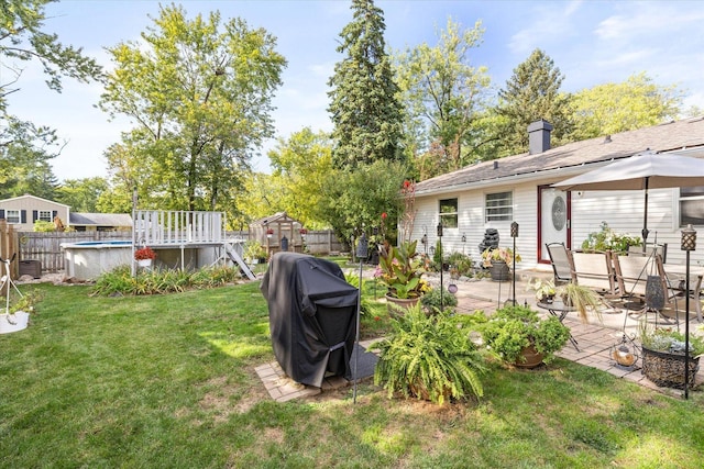 view of yard with a patio and a fenced in pool