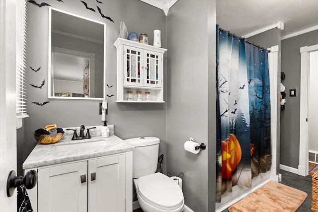 bathroom with hardwood / wood-style flooring, toilet, vanity, and ornamental molding