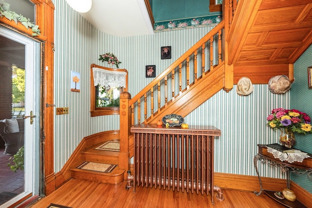 stairway featuring hardwood / wood-style flooring