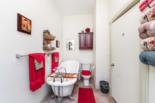 bathroom featuring toilet and a bathing tub