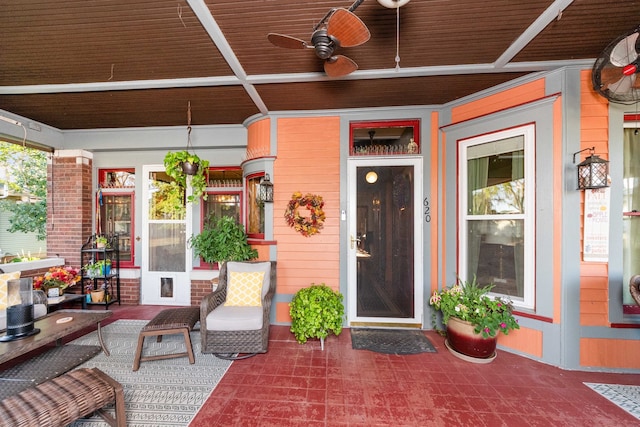 doorway to property featuring a patio and ceiling fan