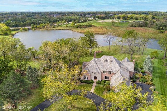 birds eye view of property with a water view