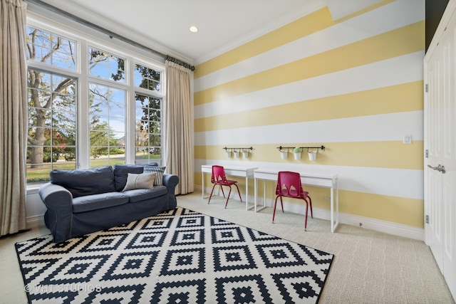 living area with carpet and ornamental molding