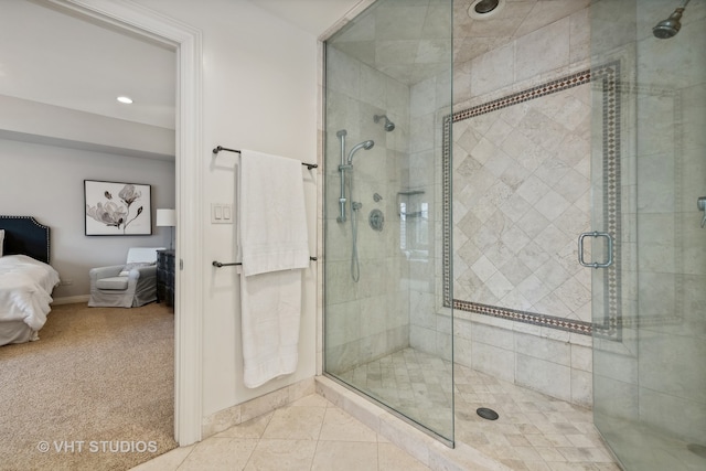 bathroom featuring tile patterned floors and a shower with door