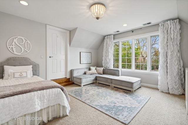 bedroom featuring carpet and lofted ceiling