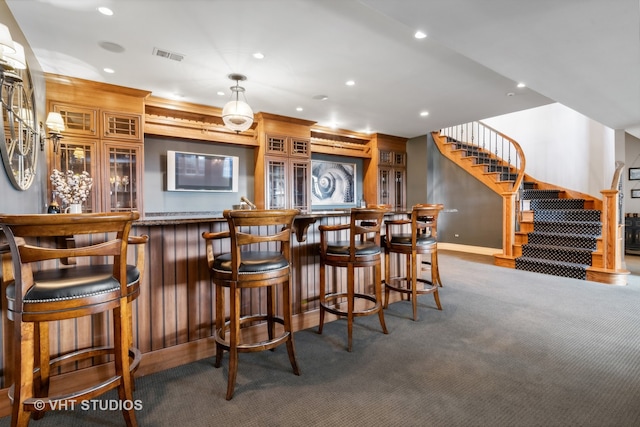 bar featuring dark colored carpet