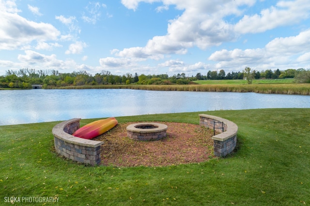 property view of water featuring an outdoor fire pit