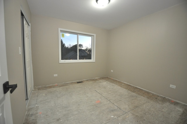 unfurnished bedroom with a closet