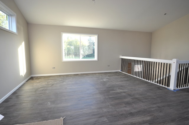 empty room with dark wood-type flooring