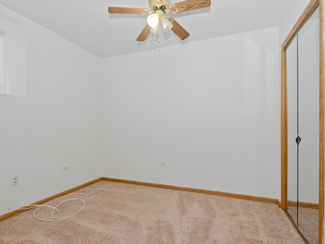 unfurnished room with carpet floors and ceiling fan