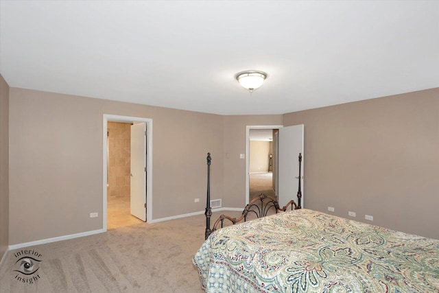 carpeted bedroom featuring visible vents and baseboards