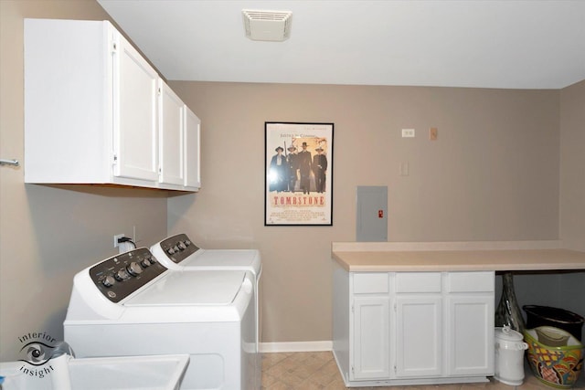 washroom with washer and clothes dryer, visible vents, cabinet space, electric panel, and baseboards