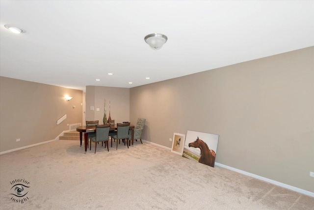 dining area featuring stairway, carpet flooring, and baseboards