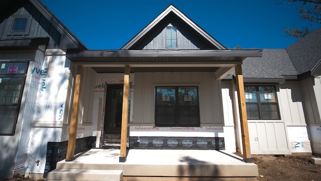 property entrance featuring covered porch