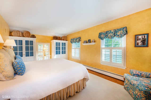 bedroom featuring a baseboard radiator