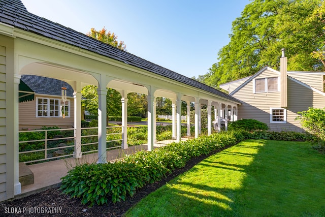 view of yard with covered porch