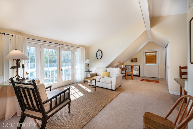 living room with french doors, light colored carpet, and vaulted ceiling