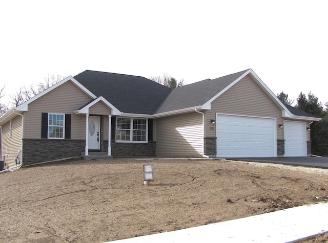 ranch-style home with a garage