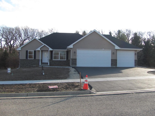 single story home with a garage